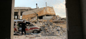 @UNICEF/Khalil Ashawi. Kafr Nubl surgical hospital, just south of Idlib, is seen after it was put out of service by attacks in early May 2019. The building and an ambulance lie in ruins