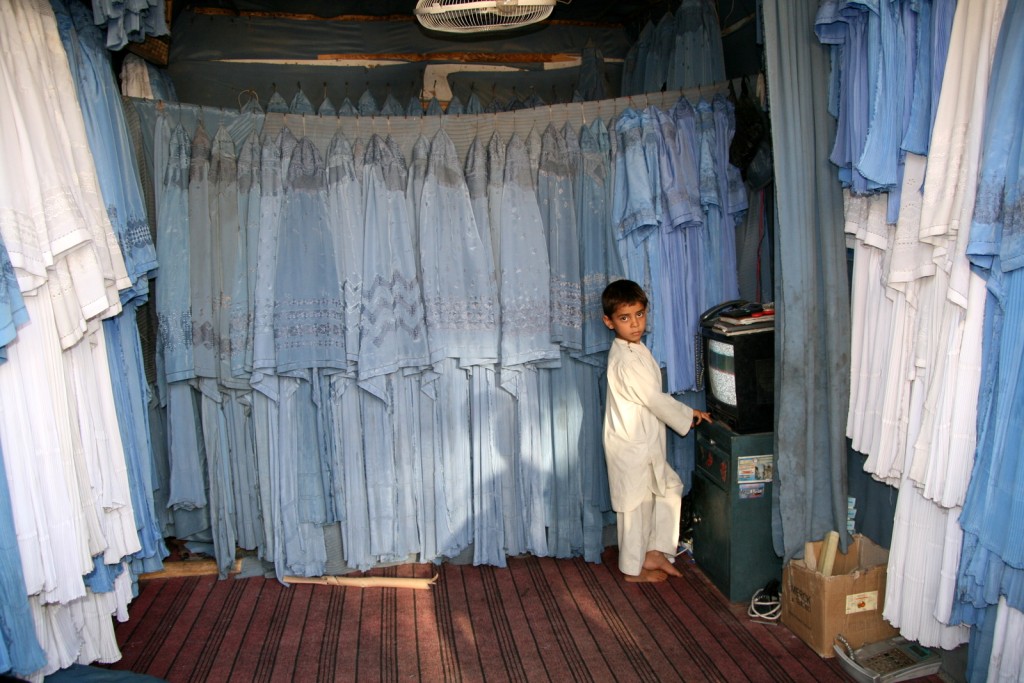 Young burqa seller in Herat, Afghanistan. Photo credits: Giuliano Battiston.