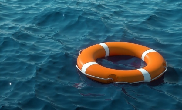 Round rescue buoy in water.